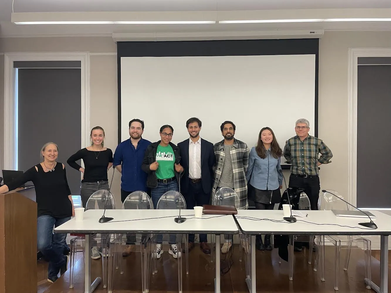 Participants in the second panel pose for a group photo.